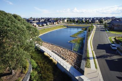 Julluck Pond features a curved bridge spillway that treats stormwater and detains flood water.