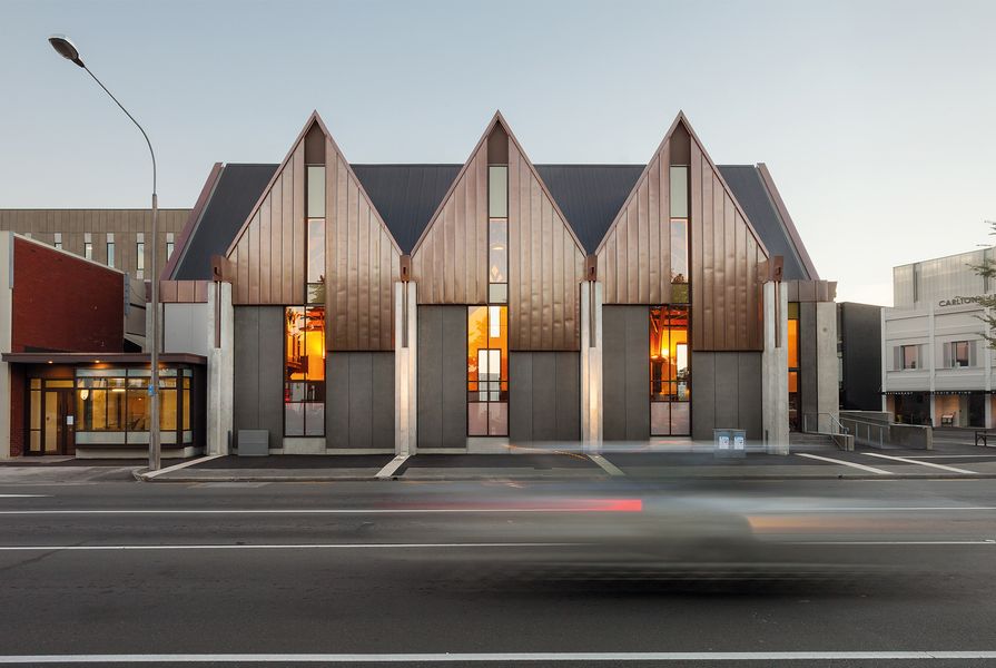 Wilkie + Bruce Architects has created a modern and lightweight interpretation of the church’s original exterior with its distinctive peaked roofline.