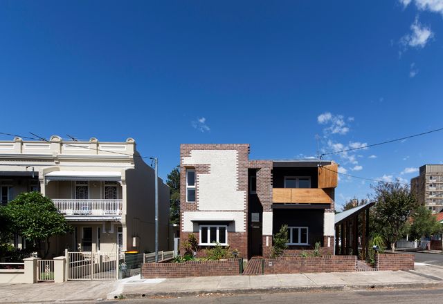 The large original house on the Marrickville site has been divided down the middle to create two dwellings with separate entries (Lots 1 and 2).