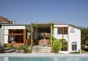 Interior spaces are redefined alongside terraces, courts and gardens, resulting in a warm and unpretentious home.