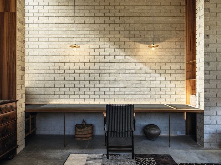A place for quiet tasks, the garden room’s off-white bricks and clerestory windows evoke a monastic quality.
