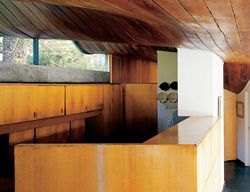 The kitchen, with its rising curving ceiling. 